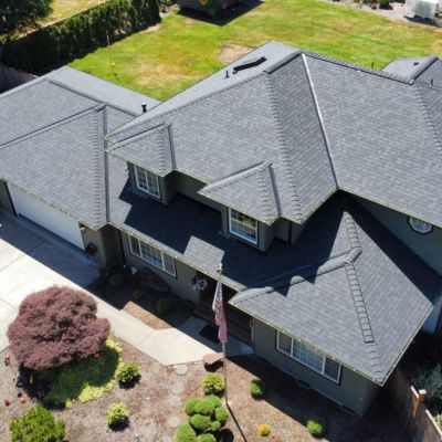 Aerial image of a new home in Washington with an asphalt shingle roof installed by SE&S Roofing.